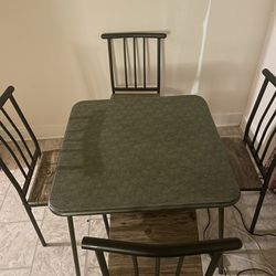 Small vintage table and 4 chairs 
