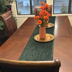 Formal Dining Room With Chairs And China Cabinet And 8 Foot Bamboo Plant In Hutch 