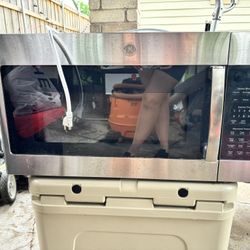 GE Appliances 1.7 Cu. Ft. Over-the-Range Microwave Oven with Sensor in Stainless Steel