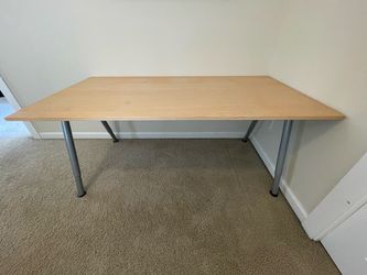 Desk with swivel chair and work lamp