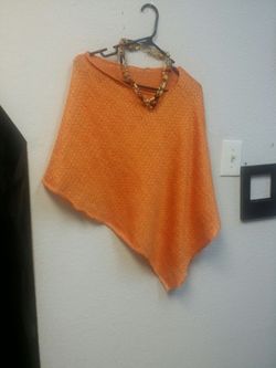 Orange poncho with necklace