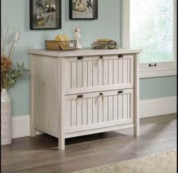 Upgrade your space with this beautiful, solid 2-drawer cabinet in a warm chalked chestnut finish — designed for both style and secure storage.
