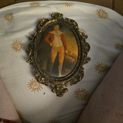AI Overview


+1
This image features a vintage miniature portrait art print of a young boy in an ornate metal oval frame, likely made in Italy