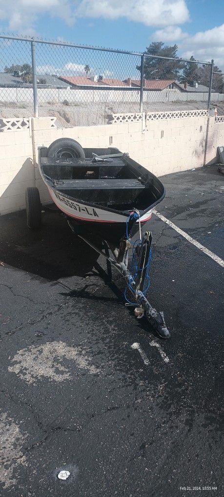 12 Ft. aluminum boat/trailer/2  1/2 HP motor