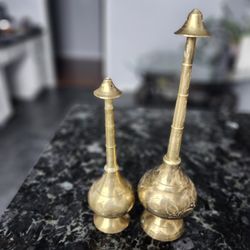 vintage brass rose water sprinklers, also known as gulab pash or gulabdani. 
)