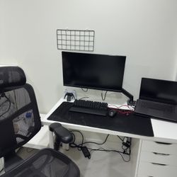 Includes Desk, Monitor, Laptop, Keyboard, And Office Chair.