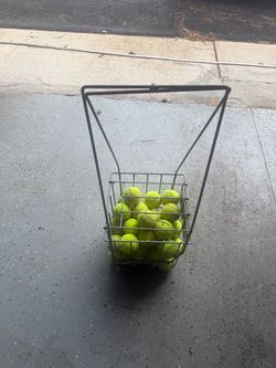 Rolling Tennis Ball Basket Sturdy metal rolling tennis ball basket with tall handle. Great for tennis practice, ball storage and easy cleanup around t