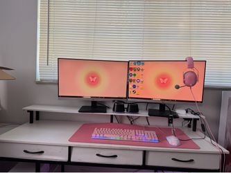 Pink PC with mouse, keyboard, 2 monitors, headset and desk