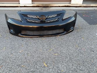 2011-2013 Toyota Corolla front bumper with Grill and fog lights accessories.