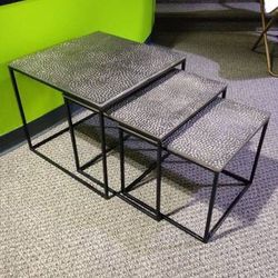 NEW! Set of 3 nesting tables. Silver metal. Black metal frame. 

