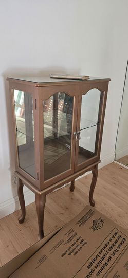 Elegant Glass Curio Display Cabinet with Glass Top $100