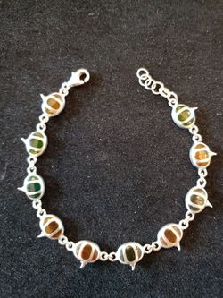 $20. Sterling pumpkin gemstone bracelet and multi colors. 7.5 in long. 5/8 in wide. Marked 925.