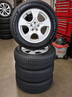 5x100 Subaru rims and new tires