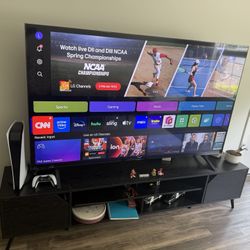 LG 75-inch Smart 4K TV and a black wooden TV stand