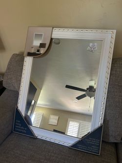 Large white mirror with golden accents