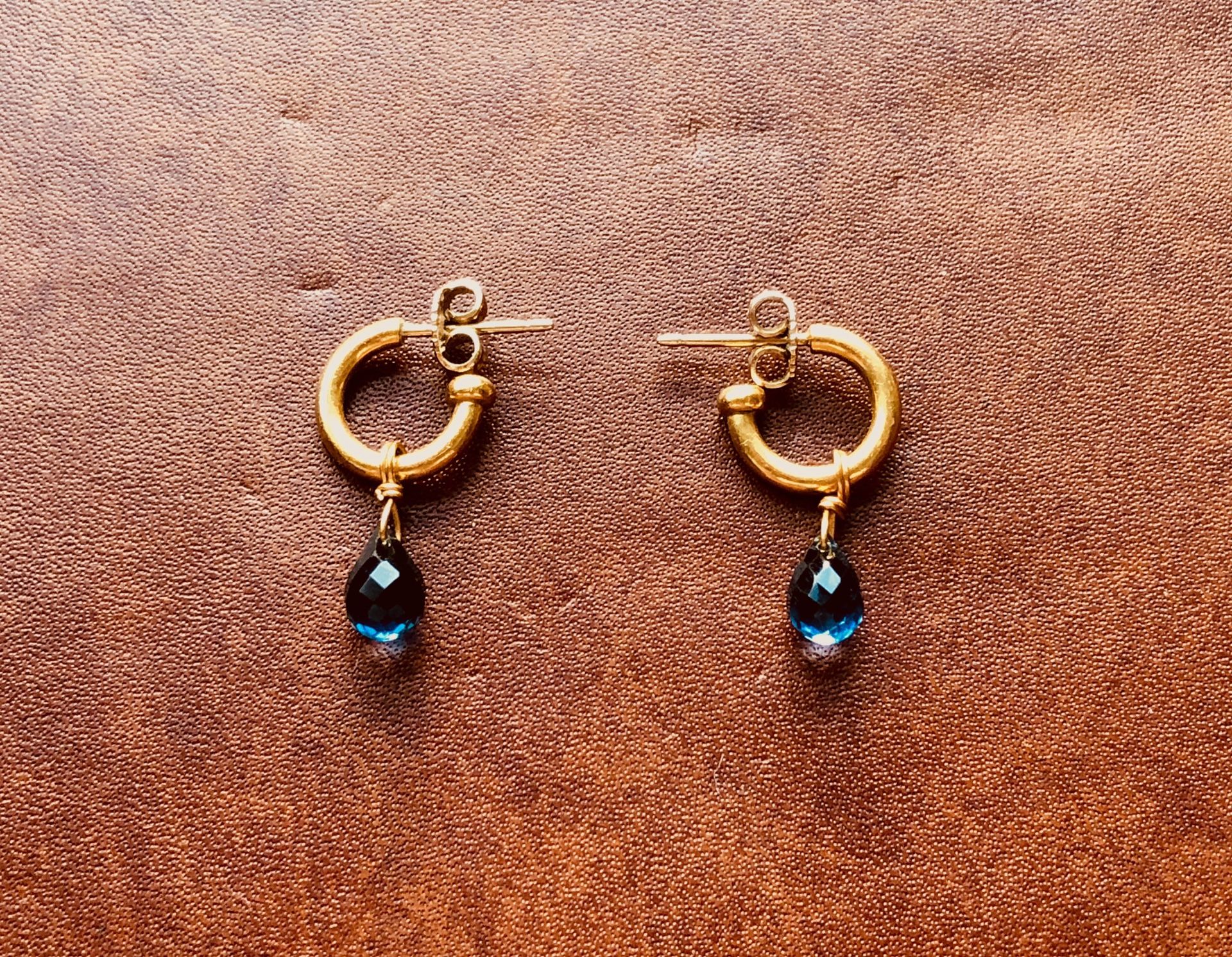 Twist 22K solid gold hoopstock earrings by Reinstein Ross NYC with removable blue topaz “drops”