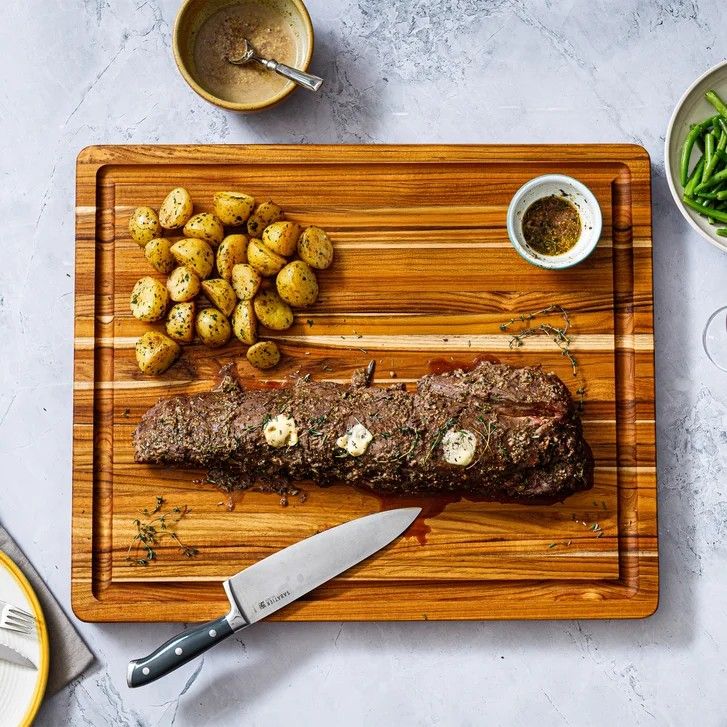 New Teakhaus Reversible XL Cutting Board with Smartphone/Tablet Cut Out. Costco price $70 plus tax.