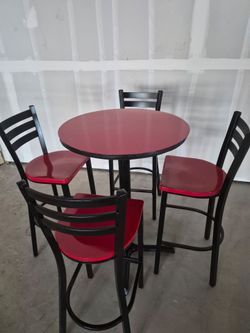 High table with four barstools