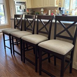 FOUR DARK WOOD UPHOLSTERED BAR STOOLS