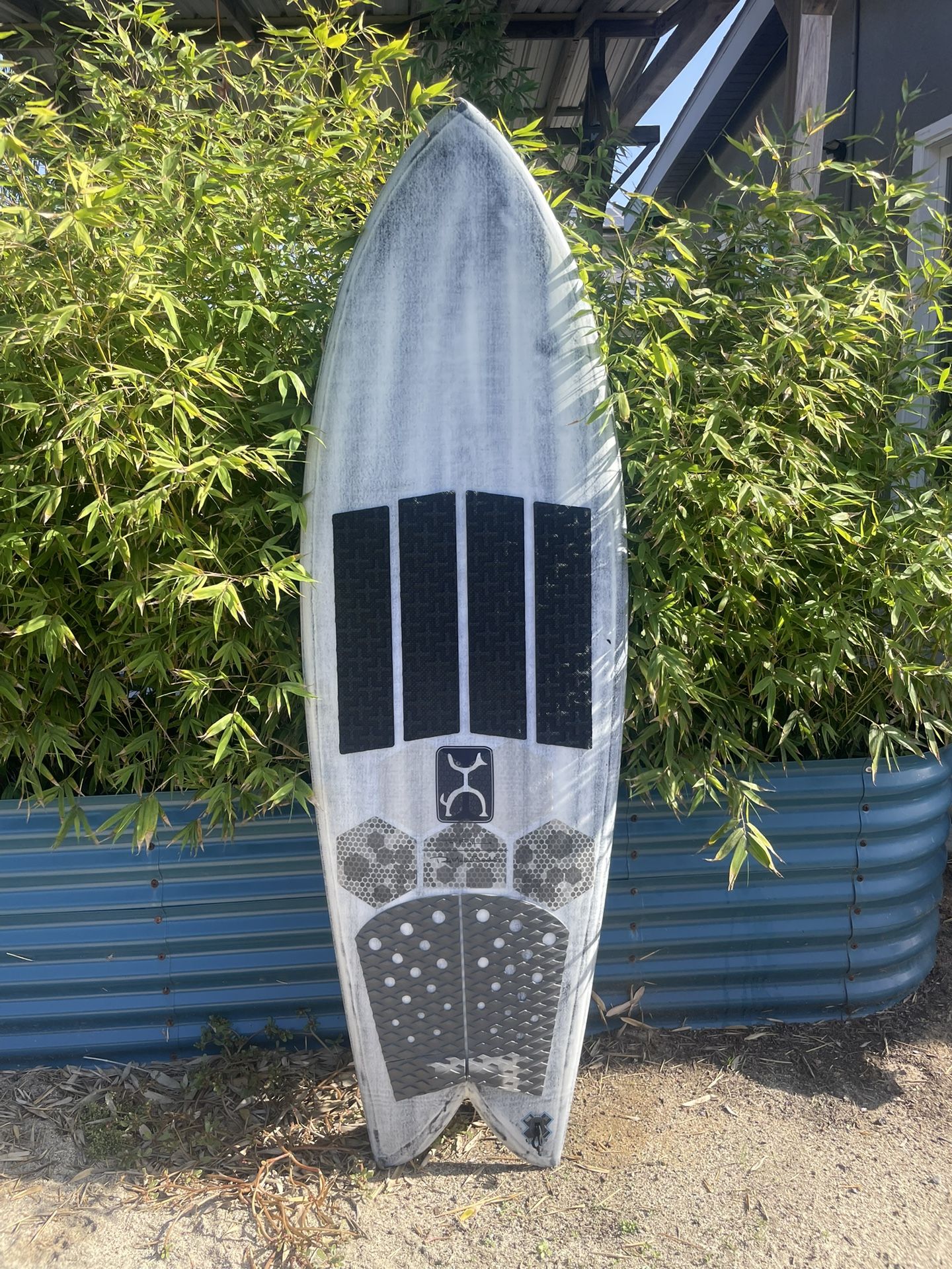 FireWire Too Fish Surfboard Volcanic 5’8” with fins and traction.