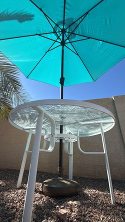 Round Glass Patio Table with Teal Umbrella with base