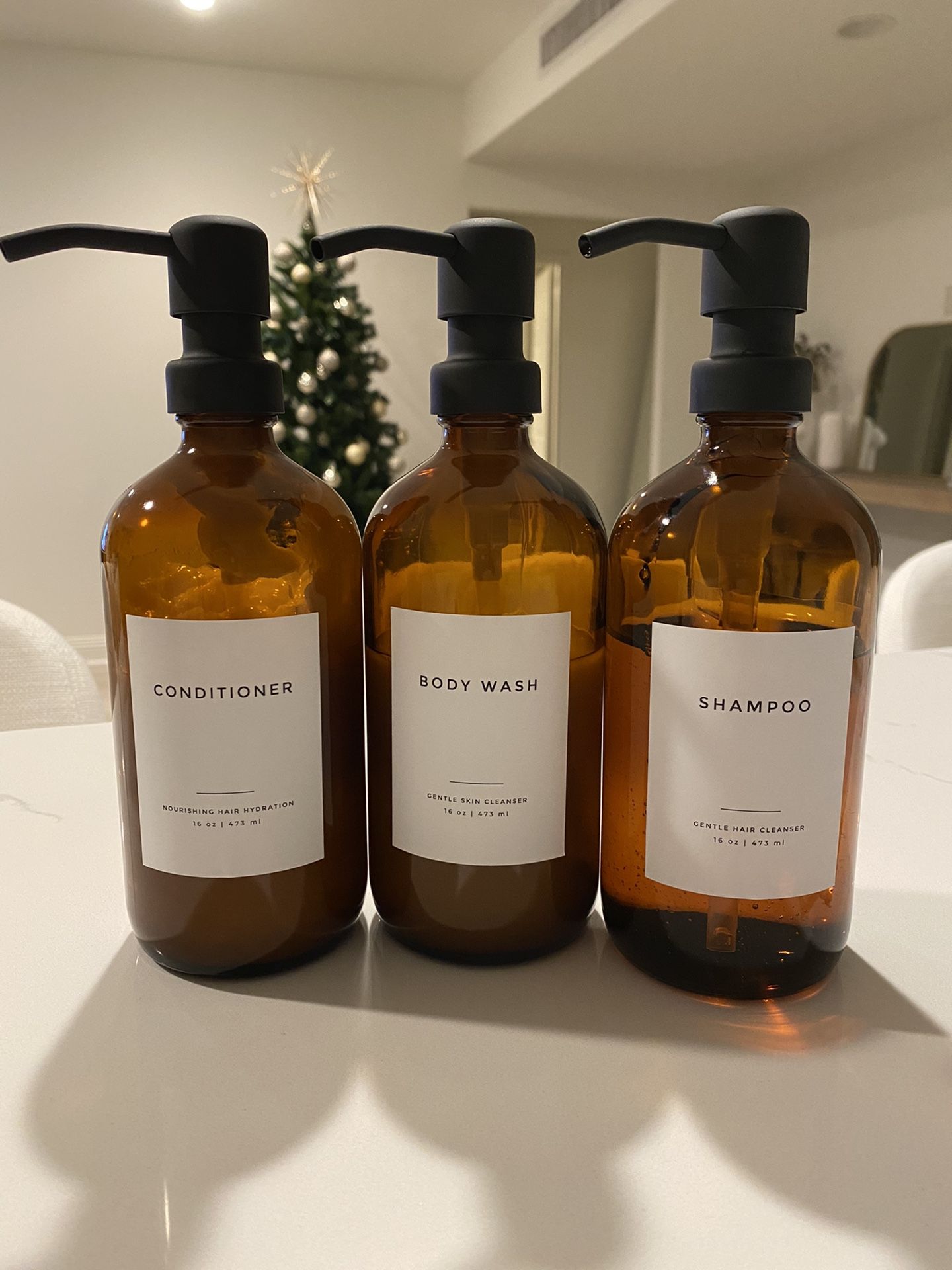 Beautiful amber glass labeled bottles shampoo, conditioner, body wash