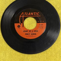 This item is a collectible vintage 7-inch 45 RPM vinyl single featuring the song "Heart of a Child" by soul singer Percy Sledge. 