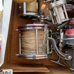 collection of vintage Penn fishing reels, specifically including models like the Penn Peer No. 209 and 309 Level Wind reels.  These reels are known fo