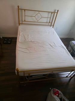 Gold metal bedframe and memory foam mattress. Size full. Used. Like new