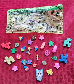 Mini erasers with case.