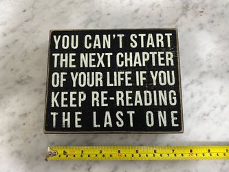 Brand new inspirational sign “ you can’t start the next chapter of your life if you keep rereading the last one”