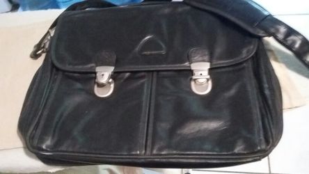 Genuine leather suitcase with key.