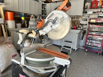 Rigid 12 inch Compound Miter Saw  ($100). And  Husky Metal Rolling cabinet on wheels ($50)