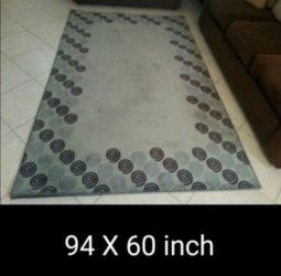 TAKING BEST OFFER. Large 94 X 60 inch floor carpet, grey with black. Good condition, needs a little cleaning.