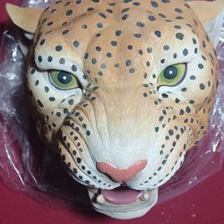 Leopard head hang on wall or sit on table.