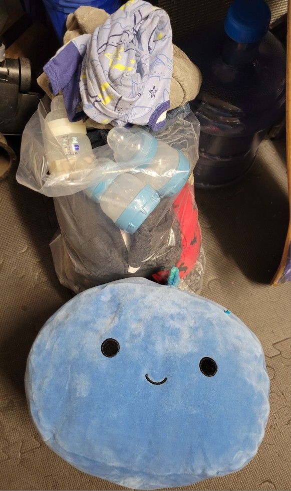 Mixed Bag Of Clothes And Bottles 