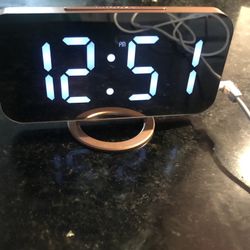 Alarm clock shaped like IPhone Has extra charging ports on side absolutely adorable