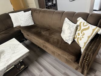 Couches, pillows, and fireplace