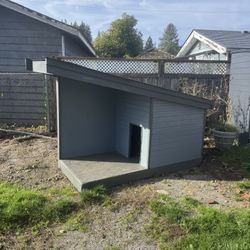A Very Large And Sturdy Wooden Dog House 