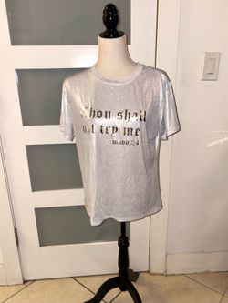 Metallic silver graphic t-shirt features a humorous slogan in gold lettering. Size L