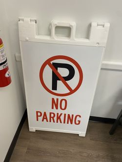 A Shape “No Parking” Sign
