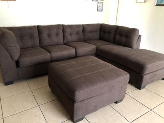 Brand new over sized sectional sofa with button tufted cushions
