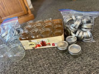 18 canning  jars with many lids