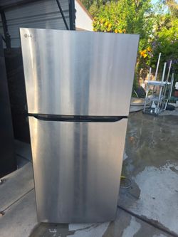 Apartment size stainless steel refrigerator