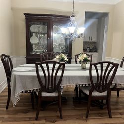 Brown china cabinet And Eating Table 6 Chairs