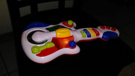 Hap-p-kid Guitar. Lights up with sound