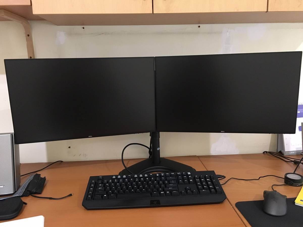 2 dell 24” ultra sharp monitors on stand