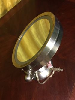 Stainless steal magnified mirror with light