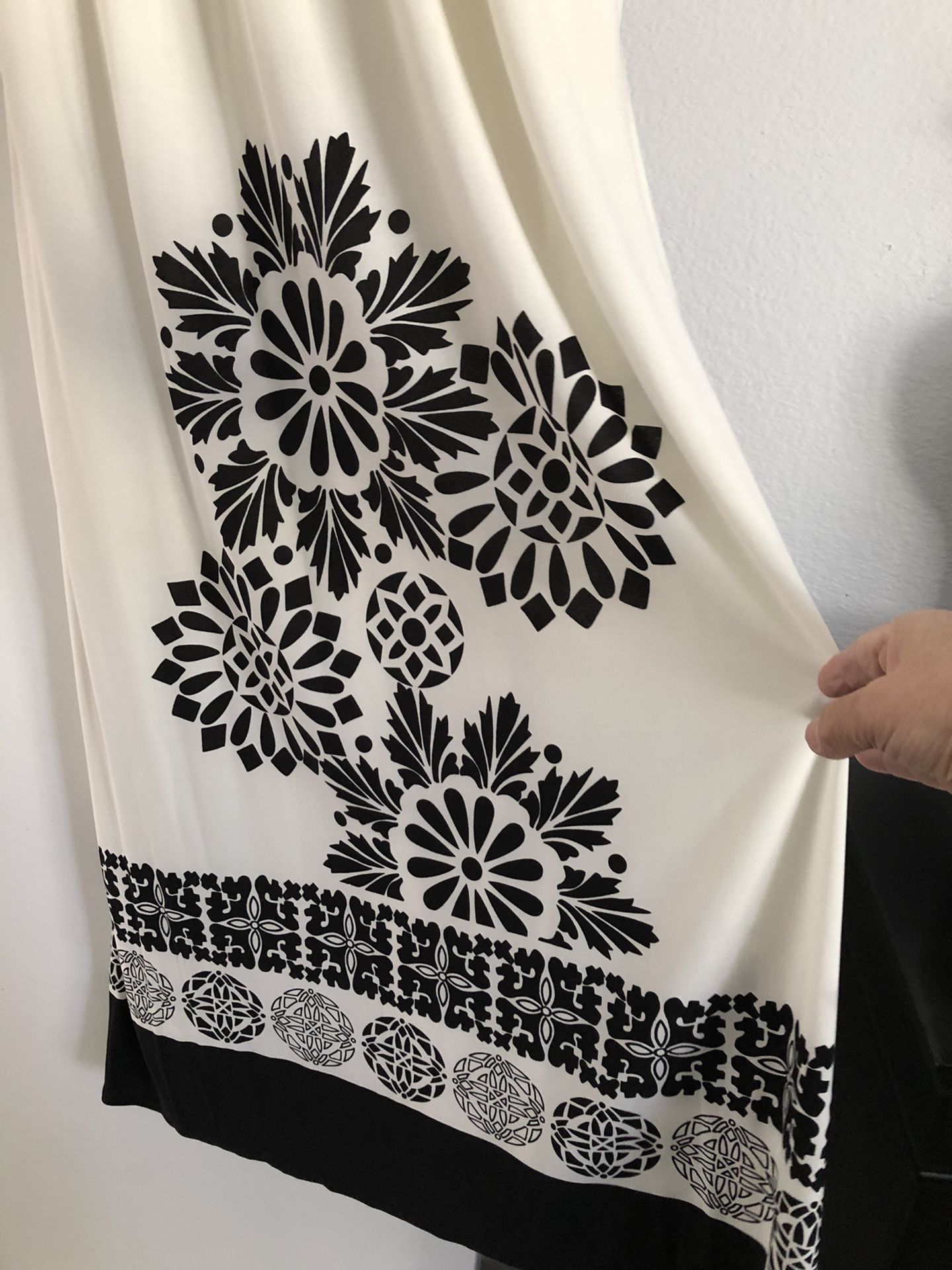 Beautiful black and white dress .