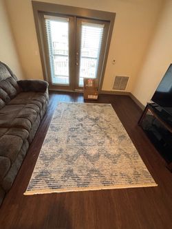 Green blue and white rug